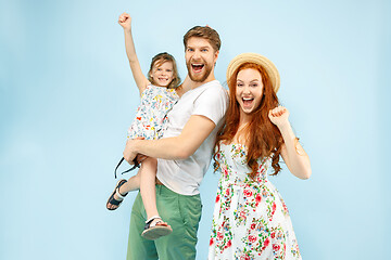 Image showing Happy parent with daughter at studio isolated on blue background