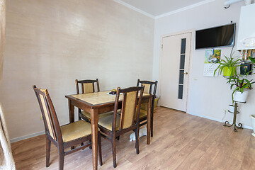 Image showing Dining table in the interior of a small kitchen