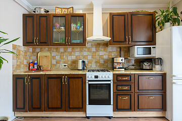 Image showing Kitchen set for dark wood in a standard apartment