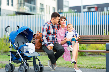 Image showing family with baby in stroller and coffee in city