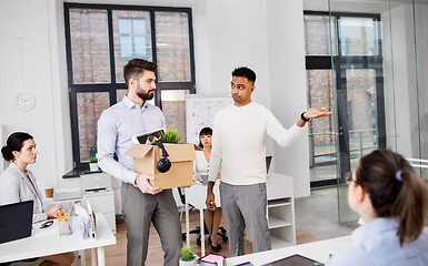 Image showing executive seeing off sad fired male office worker