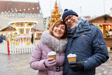 Image showing senior couple with coffee at christmas market