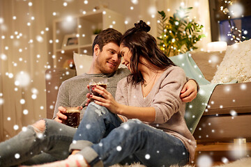 Image showing happy couple drinking coffee and eating at home