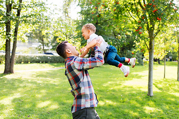 Image showing happy father with son playing in summer park