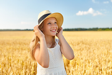 Image showing portrait of girl in straw hat on field in summer