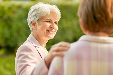 Image showing senior women or friends talking at summer park