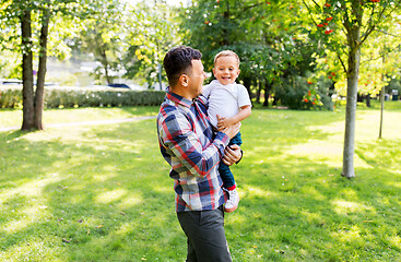 Image showing happy father with little son in summer park