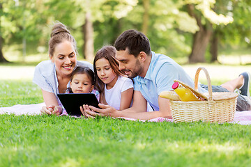 Image showing family with tablet pc on picnic in summer park