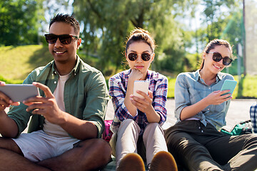 Image showing friends with smartphones at summer park