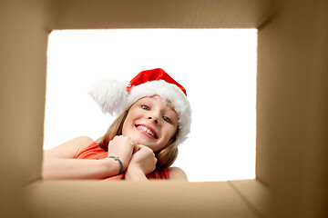 Image showing amazed girl looking into christmas gift box