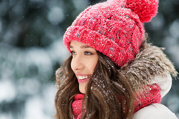 Image showing smiling teenage girl outdoors in winter