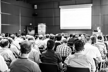 Image showing Woman giving presentation in lecture hall at university.