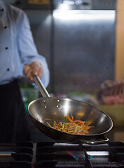 Image showing Chef doing flambe on food