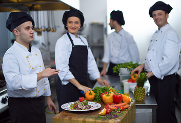 Image showing team cooks and chefs preparing meals