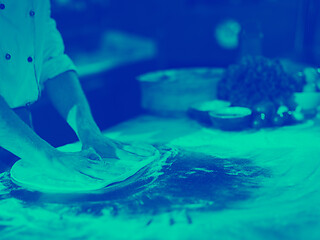 Image showing chef preparing dough for pizza