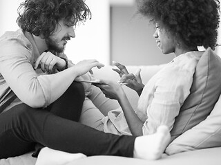 Image showing multiethnic couple in living room