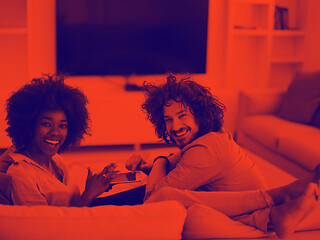 Image showing multiethnic couple in living room