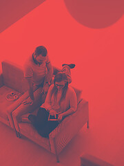 Image showing couple relaxing at  home with tablet computers