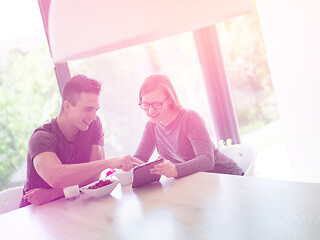 Image showing couple enjoying morning coffee and strawberries