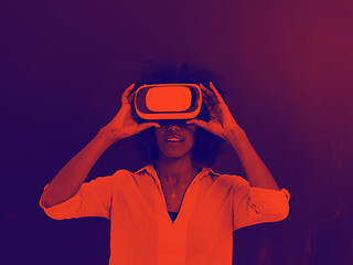 Image showing black girl using VR headset isolated on gray background