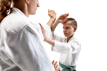 Image showing Man and teen boy fighting at aikido training in martial arts school