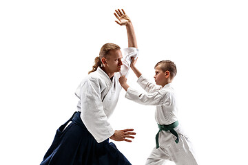 Image showing Man and teen boy fighting at aikido training in martial arts school