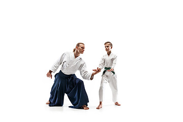 Image showing Man and teen boy fighting at aikido training in martial arts school