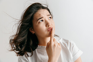 Image showing The serious sad business woman standing and looking away