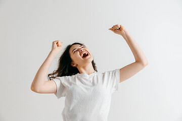 Image showing Winning success woman happy ecstatic celebrating being a winner.