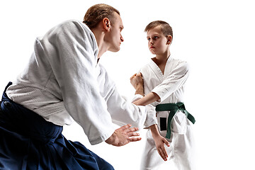 Image showing Man and teen boy fighting at aikido training in martial arts school