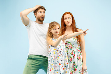 Image showing Happy parent with daughter at studio isolated on blue background