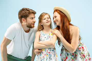 Image showing Happy parent with daughter at studio isolated on blue background