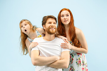 Image showing Happy parent with daughter at studio isolated on blue background