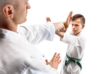 Image showing Man and teen boy fighting at aikido training in martial arts school