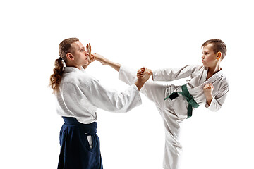 Image showing Man and teen boy fighting at aikido training in martial arts school