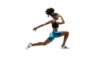 Image showing Young african woman running or jogging isolated on white studio background.