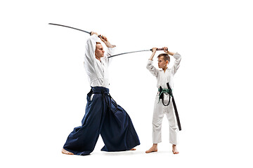 Image showing Man and teen boy fighting at aikido training in martial arts school