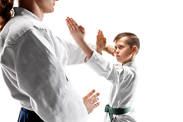 Image showing Man and teen boy fighting at aikido training in martial arts school