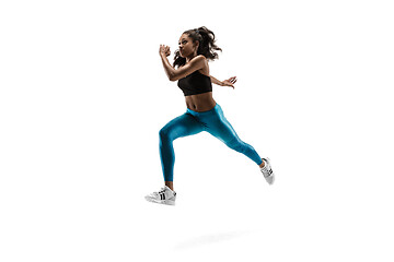 Image showing Young african woman running or jogging isolated on white studio background.