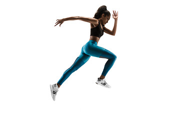 Image showing Young african woman running or jogging isolated on white studio background.