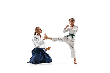 Image showing Man and teen boy fighting at aikido training in martial arts school