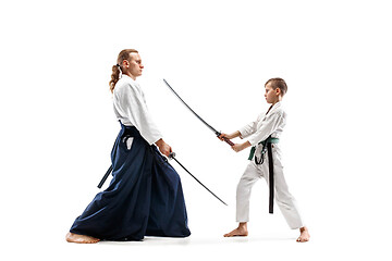 Image showing Man and teen boy fighting at aikido training in martial arts school