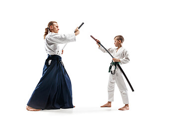 Image showing Man and teen boy fighting at aikido training in martial arts school