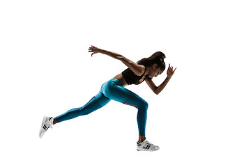 Image showing Young african woman running or jogging isolated on white studio background.