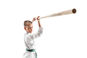Image showing Teen boy fighting with wooden sword at Aikido training in martial arts school