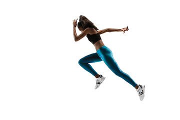 Image showing Young african woman running or jogging isolated on white studio background.