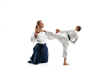 Image showing Man and teen boy fighting at aikido training in martial arts school