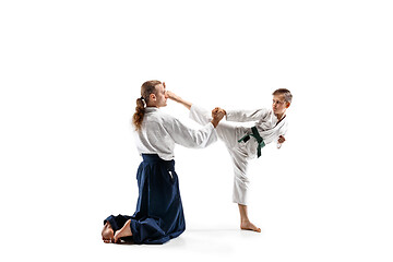 Image showing Man and teen boy fighting at aikido training in martial arts school