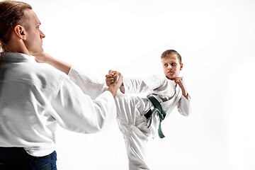 Image showing Man and teen boy fighting at aikido training in martial arts school