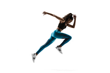 Image showing Young african woman running or jogging isolated on white studio background.